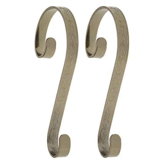 Haute Decor Stocking Scroll® Holly Embossed Antique Brass Stocking Holders, 2ct. 1 Haute Decor Stocking Scroll® Holly Embossed Antique Brass Stocking Holders, 2ct.